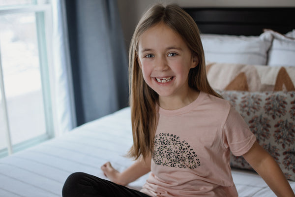 BE KIND. HAVE COURAGE. SPREAD JOY. KIDS TEE IN PEACH