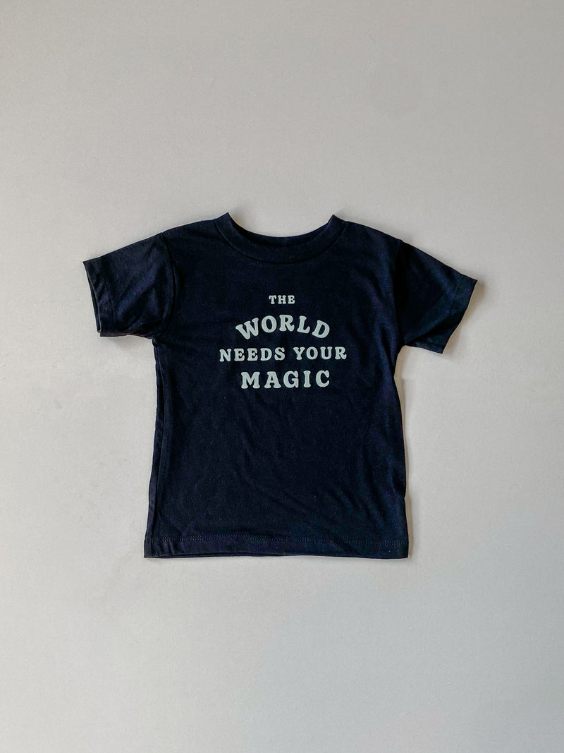 THE WORLD NEEDS YOUR MAGIC KIDS TEE IN BLACK